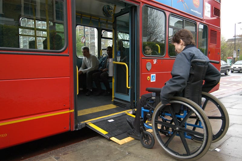 Wheelchiar user attempting to board a bus using the ramp.