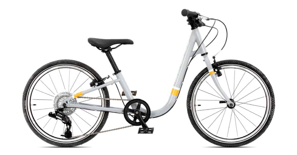 A white Islabike with black handlebars and wheels and some yellow highlight stripes. The bike has a very low central bar the curves like a U shape from seat to handlebars to allow easy stepping on and off the cycle. 