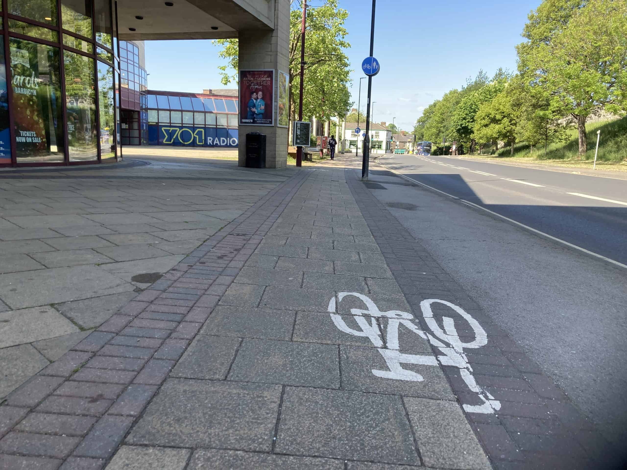 A shared use cycle track and wider public space near York Barbican.